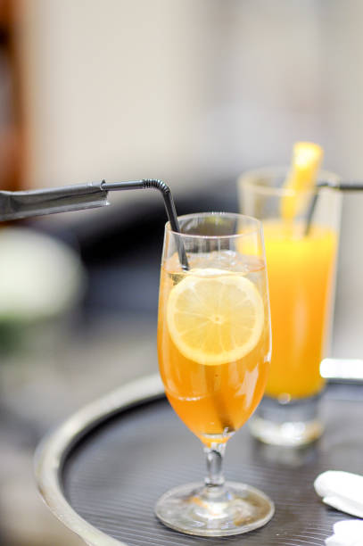 istock orange fruit juice on a tray at a party 887860578