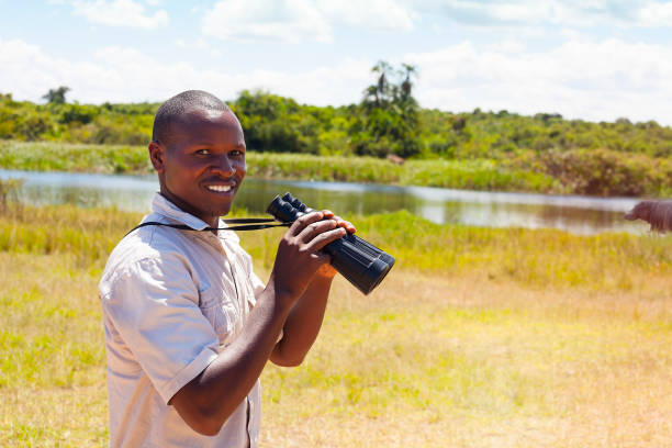 istock Using binoculars at a safari in east Africa 887863236