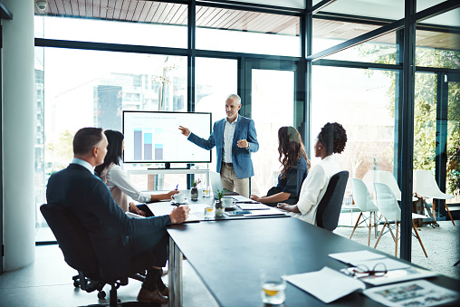 Cropped shot of a businessman giving a presentation in a boardroom