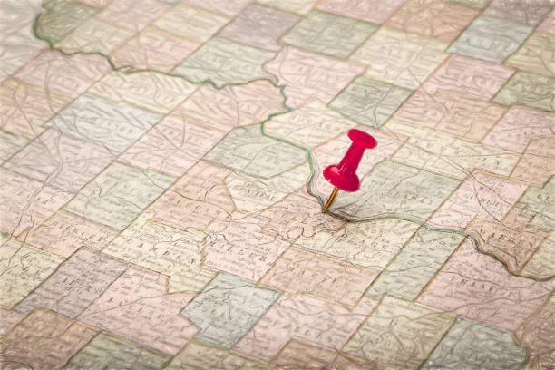 a lower Missouri River across the state of Missouri on vintage 1920s map  with a red pushpin on Jefferson City, digital painting filter applied