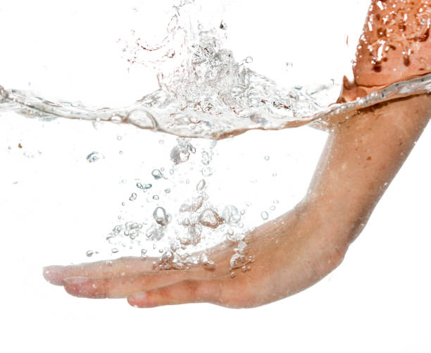 istock hand in water isolated on white background 887884538