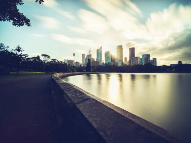 istock Sydney city skyline against sunset sky 887890816