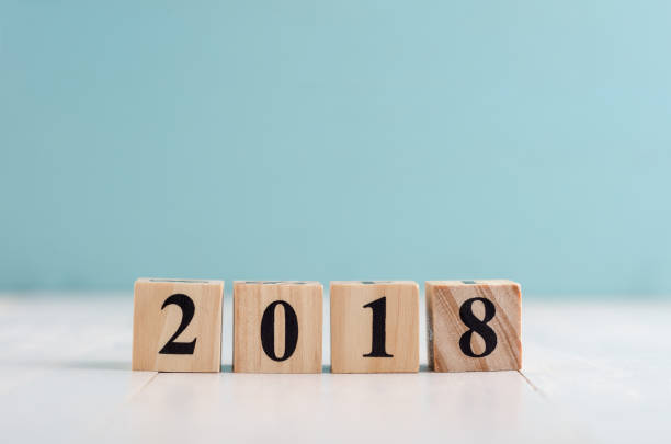 istock Wooden cube with 2018 label for new year decoration on pastel background 887890906