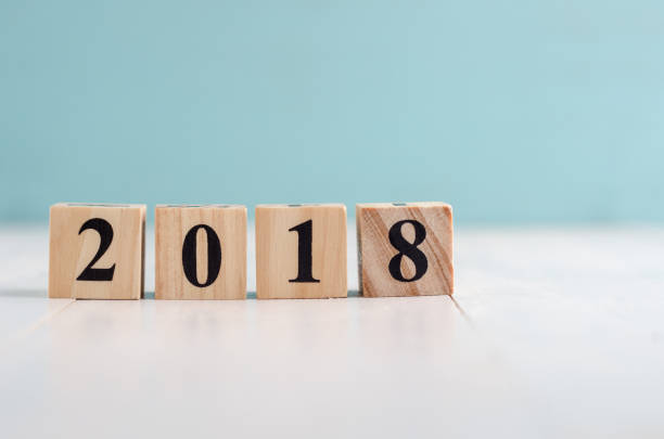 istock Wooden cube with 2018 label for new year decoration on pastel background 887890914