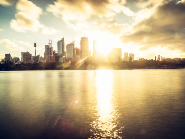 istock Sydney city skyline against sunset sky 887891392