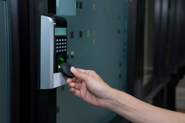istock young woman using RFID tag key to open the door 887907620