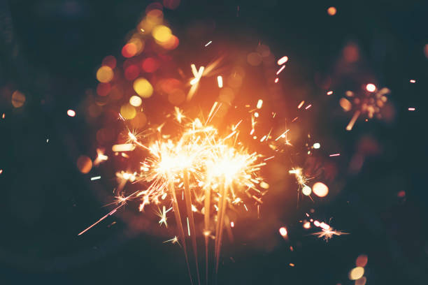 istock Sparkler with background Christmas light bokeh 887914816