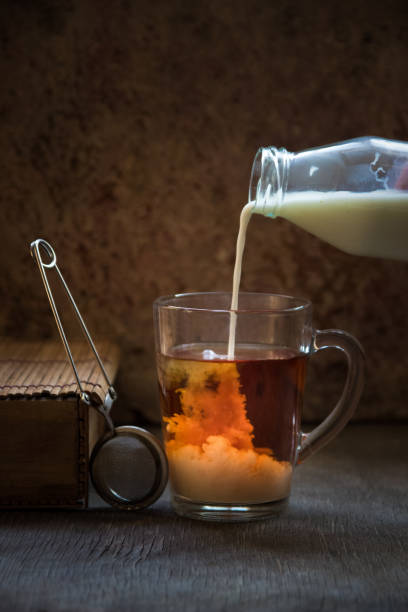 istock Tea with milk. Hot black tea in a glass mug 887914910