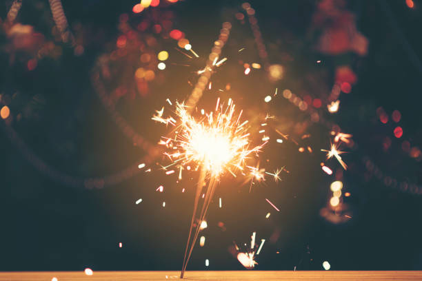 istock Sparkler with background Christmas light bokeh 887914926