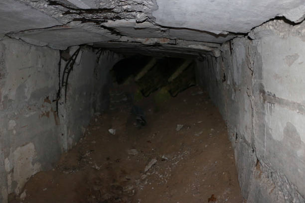 istock the old destroyed military base of missile forces after the explosions with the command post and the bomb shelter thrown in the woods 887921572