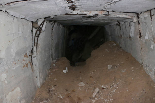 istock the old destroyed military base of missile forces after the explosions with the command post and the bomb shelter thrown in the woods 887921578