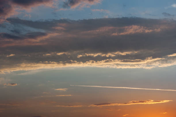 istock Sky background or texture at the sunset time with clouds. Copy space 887923832