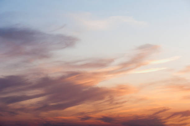 istock Sky background or texture at the sunset time with clouds. Copy space 887923950