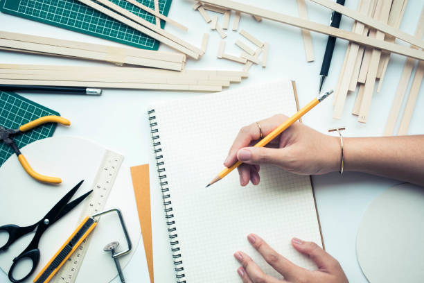 istock Female working on worktable with balsa wood material.diy 887927482