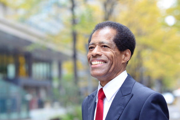 istock Mature businessman walking outside 887977160