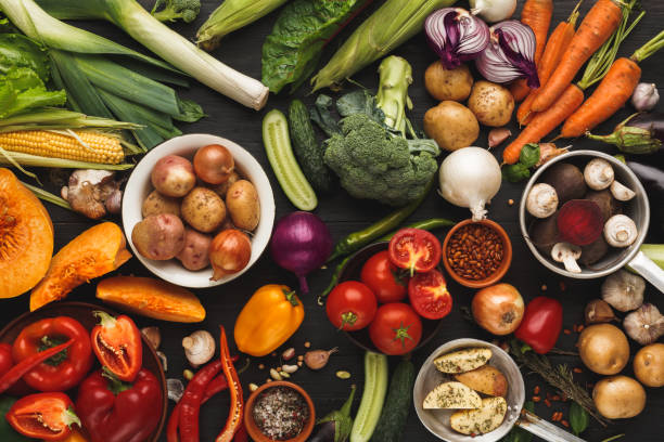 istock Heap of fresh vegetables on wooden background with copy space 887977444