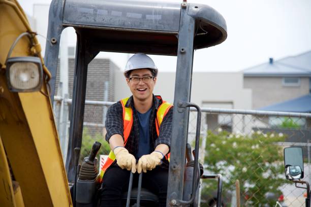 istock SYD112017 Chinese male construction worker driving machinery 887981944