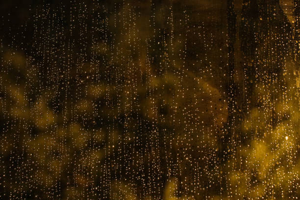 istock Drops on glass and lighs 887982070