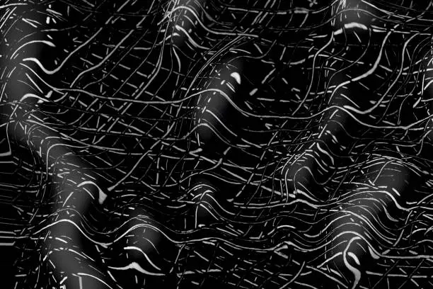 Black and white 3D scratches texture on a dark background. The image of lines on a black surface can be used as a texture for a copy paste.
