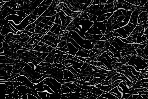 Black and white cool scratches texture on a dark background. The image of lines on a black surface can be used as a texture for a copy paste.