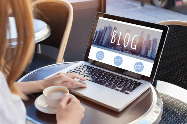 blogging, woman reading blog woman reading blog online on computer homepage photos stock pictures, royalty-free photos & images