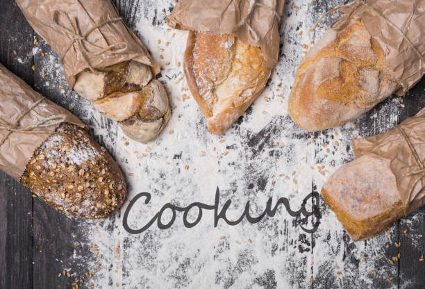 istock Bakery concept background. Bread sorts on flour 887987642