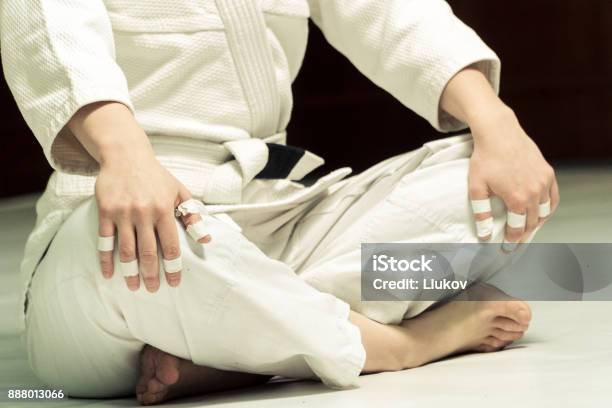 A Girl In A Kimono Kneads Before Training In Judo And Jujitsu Stock Photo - Download Image Now