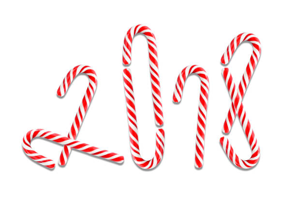 istock 2018 year, laid out with striped candies 888023938
