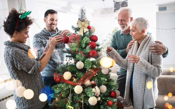 istock Family decorating a Christmas tree. 888029246