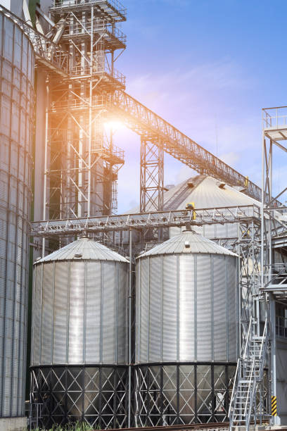 istock Agricultural Silos. Metal grain facility with silos. 888033598