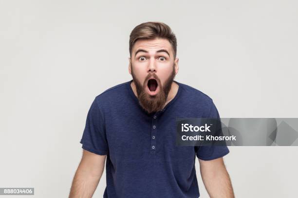 Unbelievable News Young Adult Man Open Mouth And Shocked Stock Photo - Download Image Now