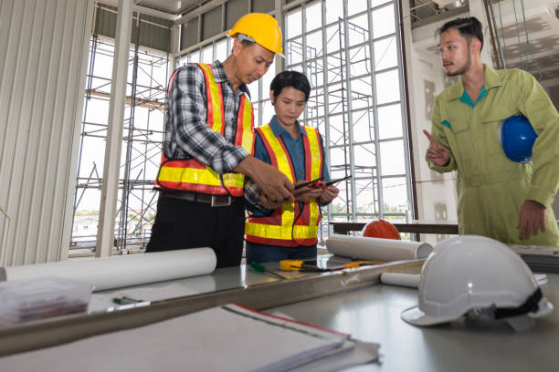 istock Engineer group asia and worker meeting, discussion with construction on site work in friendly 888037256