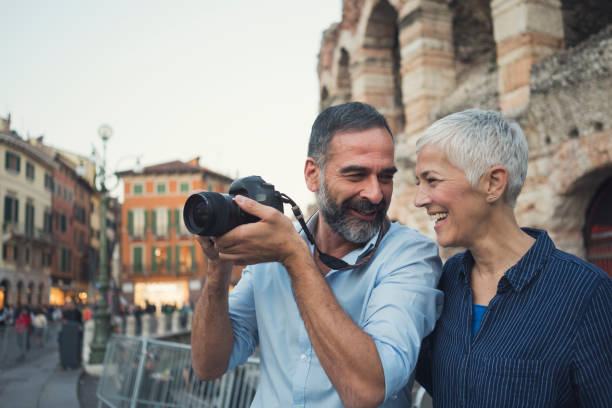 We love to travel Mature couple as tourist in city Verona tourist site stock pictures, royalty-free photos & images