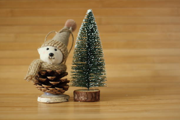 Little bear toy, Christmas present,  in front of Christmas tree
