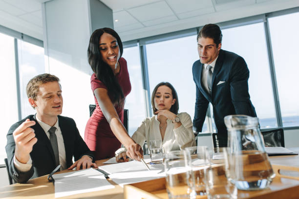 istock Corporate professionals during meeting in board room 888048484
