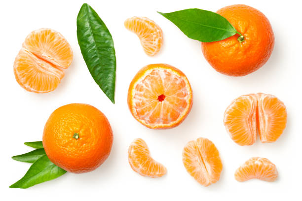 Mandarines Isolated on White Background Mandarines, tangerine, clementine with leaves isolated on white background. Top view peeled photos stock pictures, royalty-free photos & images
