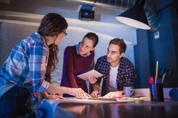 istock Female Leaders. Group of young architects working together in architecture studio 888051898