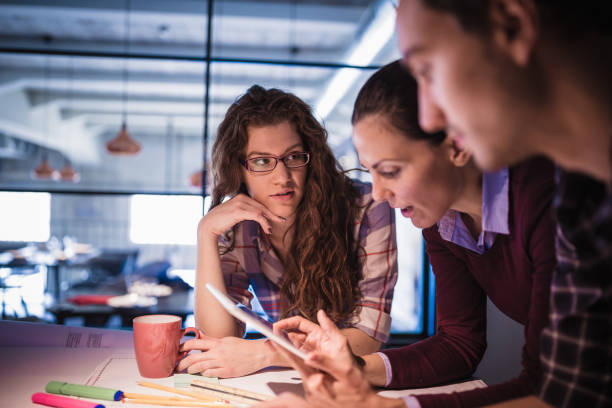 istock Female Leaders. Group of young architects working together in architecture studio 888052248