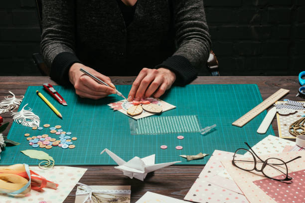 istock cropped image of woman making scrapbooking greeting postcard 888052970