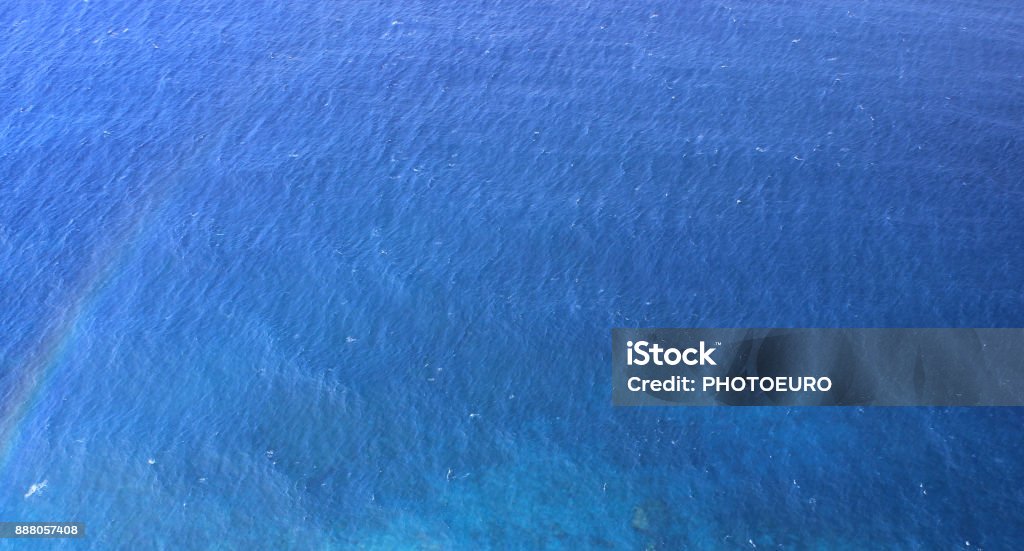 The sea from a bird's eye view. From the height of the flight, the clear water of the sea. Aerial View Stock Photo