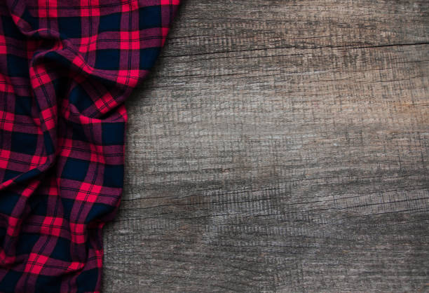 istock Checkered napkin on a wooden background 888066650