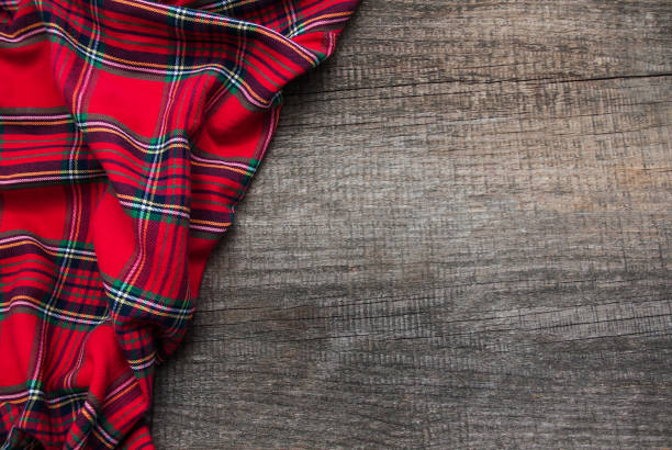 istock Checkered napkin on a wooden background 888066656