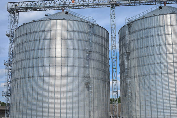 istock Agricultural Silos. Metal grain facility with silos. 888072324