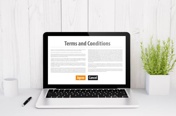 istock laptop on table terms and conditions 888075600