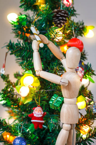 Wooden Mannequin Decorating Xmas Tree Stock Photo - Image of holiday,  green: 105561054