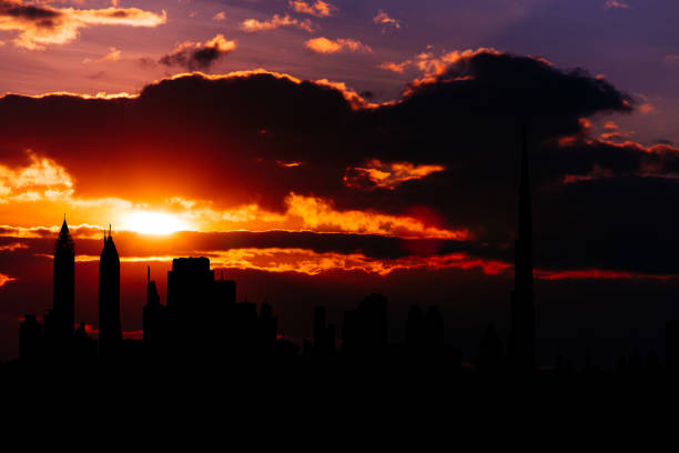 istock Dubai cityscape silhouette on sunset 888084744