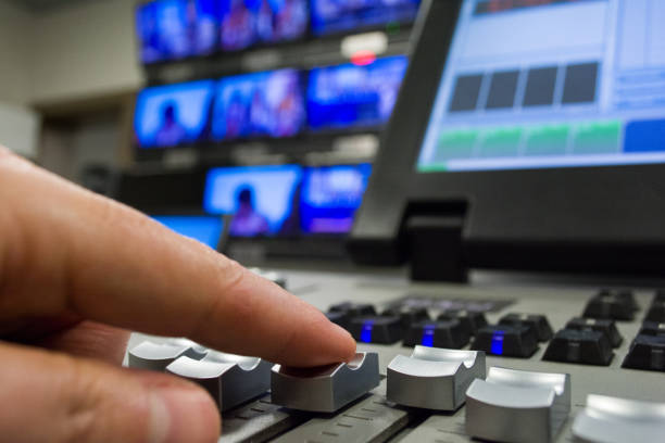istock hand on a light, mixing desk fader in blur television gallery 888089532