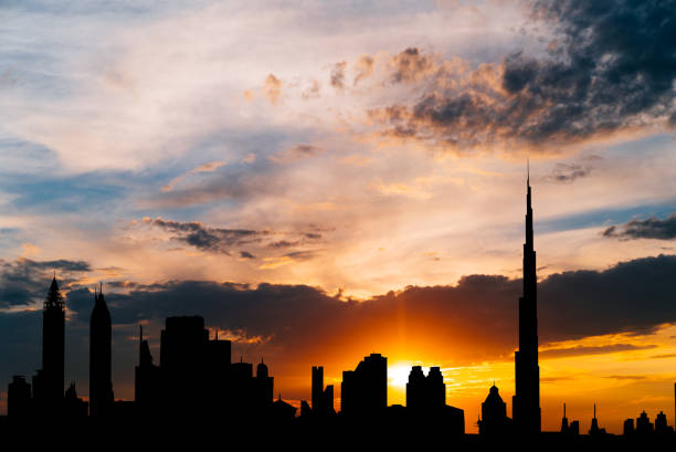 istock Dubai cityscape silhouette on sunset 888089664