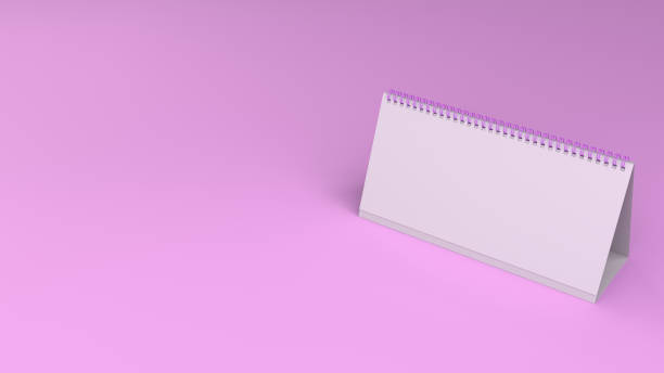 istock White table calendar mock-up on purple surface 888089992
