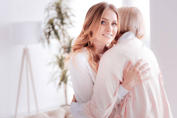 istock Delighted attractive woman hugging her mother 888095070